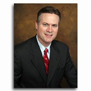 Dr. Malcom E. Baxter, MD